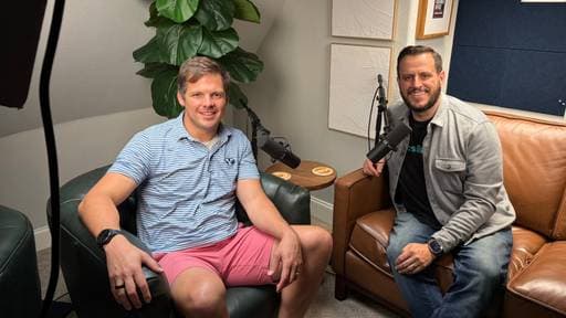 Chris Koerner and Aaron Edwards sitting beside microphones in Chris's podcast studio